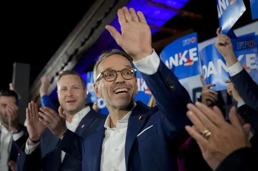 Herbert Kickl, leader of the Freedom Party of Austria waves to supporters, in Vienna, Austria, Sunday, Sept. 29, 2024, after polls closed in the country's national election. (AP Photo/Andreea Alexandru, File)