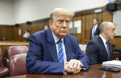 Former President Donald Trump awaits the start of proceedings on the second day of jury selection at Manhattan criminal court, April 16, 2024, in New York. Manhattan prosecutors are balking at Donald Trump efforts to delay post-trial decisions in his New York hush money criminal case as he seeks to have a federal court intervene and potentially overturn his felony conviction. They lodged their objections in a letter Tuesday to the trial judge but said they could be OK with postponing the ex-pres