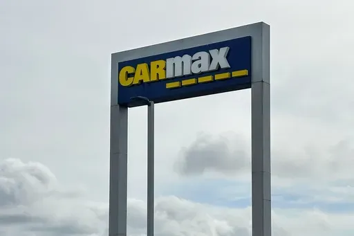 A CarMax sign stands at a location in Colma, Calif., March 4, 2024. (AP Photo/Jeff Chiu, File)