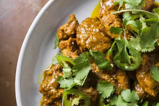 This image released by Milk Street shows a recipe for chicken vindaloo. (Milk Street via AP)