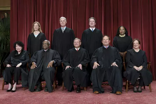 Members of the Supreme Court sit for a new group portrait following the addition of Associate Justice Ketanji Brown Jackson, at the Supreme Court building in Washington, Friday, Oct. 7, 2022. Bottom row, from left, Associate Justice Sonia Sotomayor, Associate Justice Clarence Thomas, Chief Justice of the United States John Roberts, Associate Justice Samuel Alito, and Associate Justice Elena Kagan. Top row, from left, Associate Justice Amy Coney Barrett, Associate Justice Neil Gorsuch, Associate 