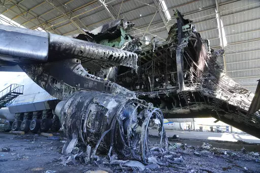 The gutted remains of an Antonov An-225, the world's biggest cargo aircraft, destroyed during recent fighting between Russian and Ukrainian forces, at the Antonov airport in Hostomel, on the outskirts of Kyiv, Ukraine, Thursday, May 5, 2022. (AP Photo/Efrem Lukatsky)