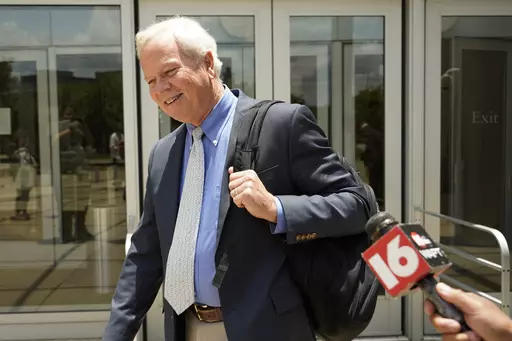 Ted Henifin, the interim third-party manager appointed by the U.S. Department of Justice to help fix the long-troubled water system of the Mississippi's capital city, begs off a reporter's question as he exits the Thad Cochran United States Courthouse in Jackson, Miss., Wednesday, June 21, 2023, following a status hearing called by United States District Court Judge Henry Wingate regarding recent comments Mayor Chokwe Antar Lumumba made about the city's water system. (AP Photo/Rogelio V. Solis)