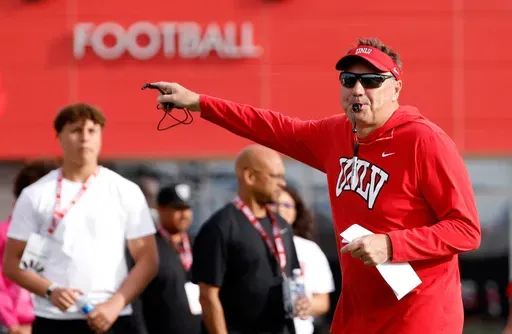 UNLV football head coach Dan Mullen blows on a whistle during a team practice in Las Vegas, Thursday, March 27, 2025. (Bizuayehu Tesfaye/Las Vegas Review-Journal via AP)