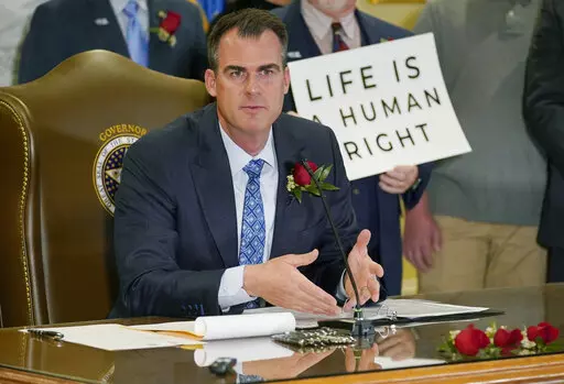 Oklahoma Gov. Kevin Stitt speaks after signing into law a bill making it a felony to perform an abortion, punishable by up to 10 years in prison, on. April 12, 2022, in Oklahoma City. Stitt on Wednesday, May 25 signed into law the nation’s strictest abortion ban, making the state the first in the nation to effectively end availability of the procedure. State lawmakers approved the ban enforced by civil lawsuits rather than criminal prosecution, similar to a Texas law that was passed last year.