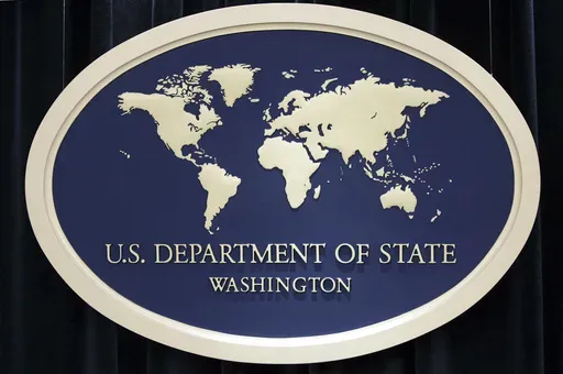In this Aug. 10, 2006, file photo, the sign used as the backdrop for press briefings at the U.S. Department of State is seen before a news conference at the State Department in Washington. A Christian pastor from California has been freed from China after nearly 20 years behind bars and is back home in the U.S., the State Department said. Two groups say the 68-year-old David Lin was detained after he entered China in 2006, convicted of contract fraud and sentenced to life in prison. (AP Photo/Ch