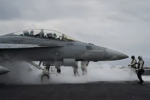 F/A-18F Super Hornet fighter jet takes off from the aircraft carrier U.S.S. Dwight D. Eisenhower, also known as the 'IKE', in the south Red Sea, Tuesday, Feb. 13, 2024. (AP Photo/Bernat Armangue)