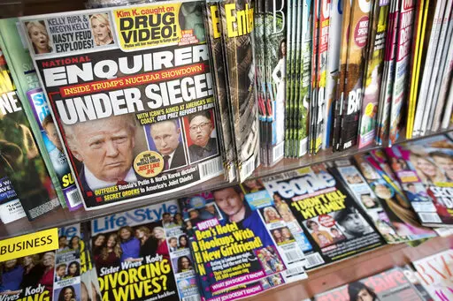 In this July 12, 2017 file photo, an issue of the National Enquirer featuring President Donald Trump on its cover is displayed on a newsstand in a store in New York. VVIP Ventures is buying the U.S. and U.K editions of the National Enquirer, the tabloid that engaged in “catch-and-kill” practices to bury stories about Donald Trump during his presidential campaign. Financial terms were not disclosed. (AP Photo/Mary Altaffer, File)