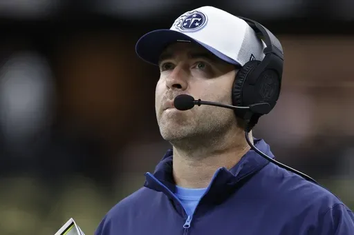Tennessee Titans head coach Brian Callahan watches during the second half of an NFL preseason football game against the New Orleans Saints, Sunday, Aug. 25, 2024, in New Orleans. (AP Photo/Butch Dill)