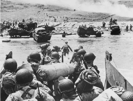 American soldiers and supplies arrive on the shore of the French coast of German-occupied Normandy during the Allied D-Day invasion on June 6, 1944 in World War II. Nearly 160,000 Allied troops landed in Normandy on June 6, 1944. Of those, 73,000 were from the United States, 83,000 from Britain and Canada. Forces from several other countries were also involved, including French troops fighting with Gen. Charles de Gaulle. The Allies faced around 50,000 German forces. (AP Photo, File)