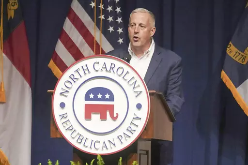 North Carolina GOP Chairman Michael Whatley speaks at the state party's convention on June 9, 2023, in Greensboro, N.C. Republican presidential candidate former President Donald Trump is calling for a leadership change at the Republican National Committee in an attempt to install a new slate of loyalists at the top of the GOP's political machine even before he formally secures the party's next presidential nomination. Trump is calling for Ronna McDaniel to be replaced by Whatley. (AP Photo/Meg K