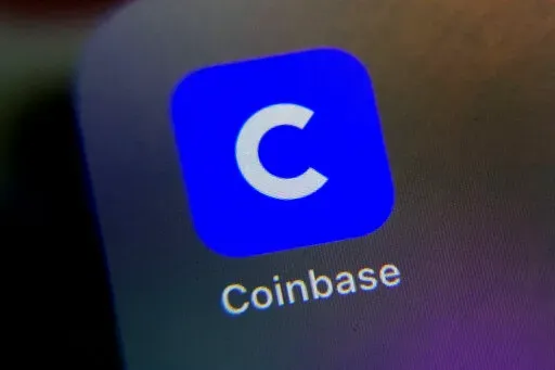 The mobile phone icon for the Coinbase app is shown in this photo, in New York, Tuesday, April 13, 2021. Cryptocurrency trading platform Coinbase has lost half its value in the past week, including its biggest one-day drop ever on Wednesday, May 11, 2022,  as the famously volatile crypto market weathers yet another slump.   (AP Photo/Richard Drew, File)