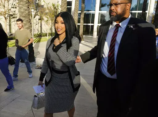 Cardi B exits federal court as proceedings continue in a $5 million copyright infringement lawsuit against her in federal court, Wednesday, Oct. 19, 2022, in Santa Ana, Calif. Kevin Michael Brophy is suing the Grammy-winning musician for allegedly misusing his likeness for her sexually suggestive mixtape cover art in 2016. (AP Photo/Chris Pizzello)