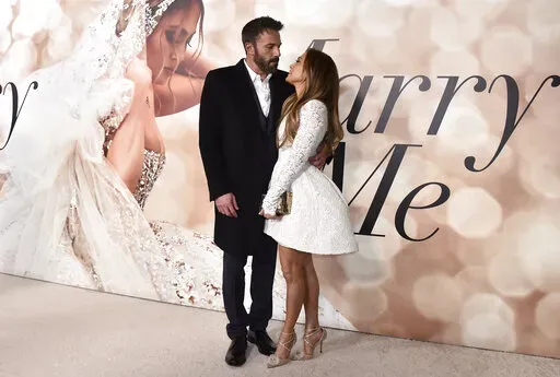 Cast member Jennifer Lopez, right, and Ben Affleck attend a photo call for a special screening of "Marry Me" at DGA Theater on Tuesday, Feb. 8, 2022, in Los Angeles.  Lopez has an engagement ring on her finger, and Affleck may be the one who put it there. “So, I have a really exciting and special story to share,” a giggling Lopez said in a video posted Friday, April 8,  on her Twitter feed. She said more could be found on the website for her “inner circle,” OnTheJLo.com, which requires v