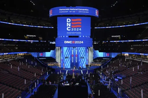 Workers prepare the convention floor at United Center before the Democratic National Convention Sunday, Aug. 18, 2024, in Chicago. (AP Photo/Paul Sancya)
