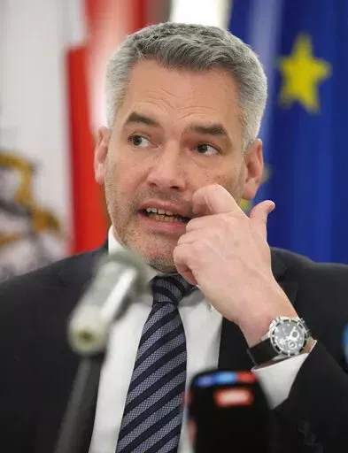 Austria's Chancellor Karl Nehammer speaks during a news conference after his meeting with Russian President Vladimir Putin in Moscow, Russia, Monday, April 11, 2022. (AP Photo/Alexander Zemlianichenko)