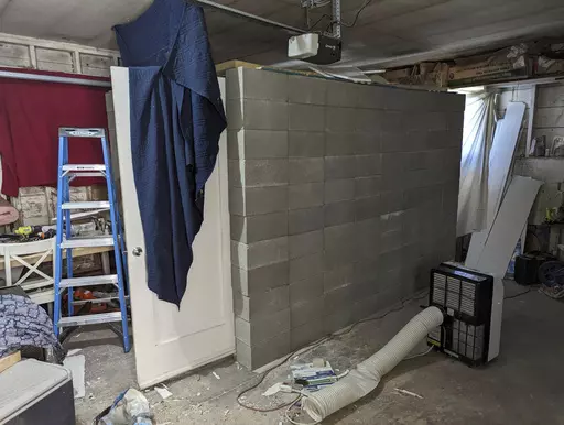 This undated photo provided by the Federal Bureau of Investigation's Portland Field Office shows a makeshift cinderblock cell in Klamath Falls, Ore. allegedly used by 29-year-old, Negasi Zuberi. Authorities say Zuberi who posed as an undercover police officer kidnapped a woman in Seattle, drove her hundreds of miles to his home in Oregon, and kept her in a makeshift cell from which she eventually escaped and found help. The FBI said Tuesday, Aug. 1, 2023, that police in Reno, Nevada, arrested Zu