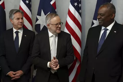 Australian Prime Minister Anthony Albanese, center, speaks with U.S. Secretary of State Antony Blinken, left, and U.S. Defense Secretary Lloyd Austin prior to a lunch in Brisbane, Australia Friday, July 28, 2023. (Pat Hoelscher/Pool Photo via AP)