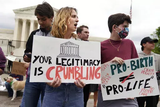 Demonstrators protest outside of the U.S. Supreme Court, Thursday, May 5, 2022, in Washington. A draft opinion suggests the U.S. Supreme Court could be poised to overturn the landmark 1973 Roe v. Wade case that legalized abortion nationwide, according to a Politico report released Monday. Whatever the outcome, the Politico report represents an extremely rare breach of the court's secretive deliberation process, and on a case of surpassing importance. (AP Photo/Mariam Zuhaib)