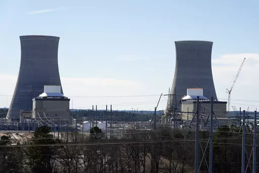 Units 3, left, and 4 and their cooling towers stand at Georgia Power Co.'s Plant Vogtle nuclear power plant, Jan. 20, 2023, in Waynesboro, Ga. Federal nuclear regulators announced on Friday, July 28, that they had cleared Georgia Power and its co-owners to load radioactive fuel into Unit 4, shown at right, the second of two new reactors on the site. (AP Photo/John Bazemore, File)