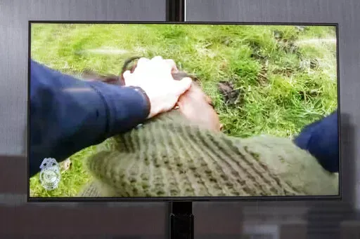 A TV display shows video evidence of a Grand Rapids police officer struggling with and shooting Patrick Lyoya at Grand Rapids City Hall on Wednesday, April 13, 2022. Lyoya, 26, was shot and killed about 8:10 a.m., on April 4, after what police said was a traffic stop. (Grand Rapids Police Department)