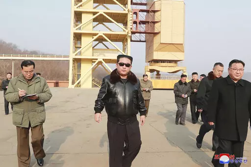 In this undated photo provided by the North Korean government on Friday, March 11, 2022, North Korean leader Kim Jong Un visits the Sohae Satellite Launching Ground in Tongchang-ri, North Korea. Independent journalists were not given access to cover the event depicted in this image distributed by the North Korean government. The content of this image is as provided and cannot be independently verified. Korean language watermark on image as provided by source reads: "KCNA" which is the abbreviati