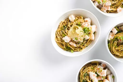 This image released by Milk Street shows a recipe for Ramen Salad with Shrimp and Scallions. (Milk Street via AP)