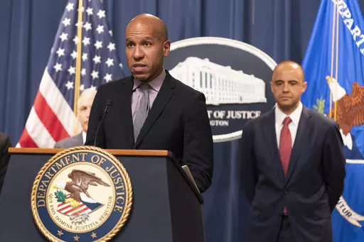Under Secretary of the Treasury for Terrorism and Financial Intelligence Brian Nelson with U.S. Attorney Matthew Graves for the District of Columbia, speaks during a news conference, Tuesday, April 25, 2023, at the Department of Justice in Washington. The Justice Department says British American Tobacco has agreed to a $629 million settlement to resolve allegations that it did illegal business with North Korea. In addition, federal prosecutors disclosed a cigarette trafficking scheme that raised