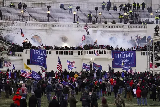 People loyal to President Donald Trump storm the U.S. Capitol on Jan. 6, 2021, in Washington. Federal authorities say a Southern California man who assaulted police with pepper spray during the storming of the U.S. Capitol was sentenced to 4 1/2 years in prison. The U.S. Department of Justice said in a statement Friday, April 28, 2023, that Jeffrey Scott Brown of Santa Ana, Calif., received a sentence of 54 months. (AP Photo/John Minchillo, File)