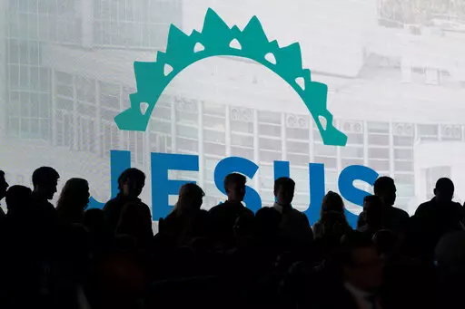 Choir members are silhouetted as they get ready for a worship service at the Southern Baptist Convention’s annual meeting in Anaheim, Calif., Tuesday, June 14, 2022. (AP Photo/Jae C. Hong)