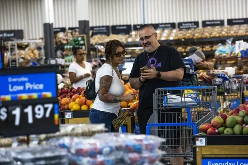 Shoppers pause in the produce section at a Walmart Superstore in Secaucus, New Jersey, July 11, 2024. (AP Photo/Eduardo Munoz Alvarez, File)
