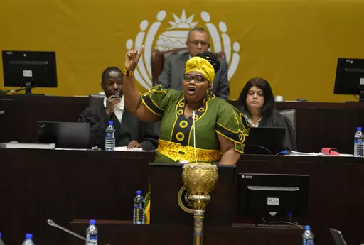 Pemmy Majodina, chief whip of the ruling African National Congress, addresses members of parliament in Cape Town, South Africa, Tuesday, Nov. 21, 2023. The majority of MP's voted to close the Israeli embassy in South Africa over the war in Gaza. (AP Photo/Nardus Engelbrecht)