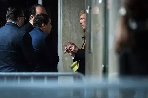 Former President Donald Trump speaks with attorney Todd Blanche and staff outside of the courtroom as jurors began deliberations for his criminal trial at Manhattan Criminal Court in New York on Wednesday, May 29, 2024. Trump was charged with 34 counts of falsifying business records last year, which prosecutors say was an effort to hide a potential sex scandal, both before and after the 2016 presidential election. Trump is the first former U.S. president to face trial on criminal charges. (Jabin