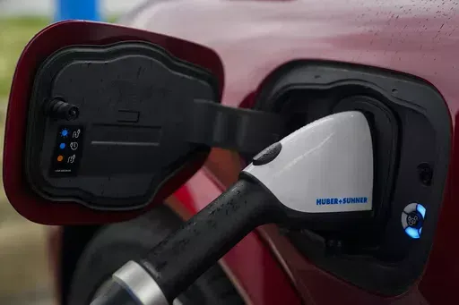 A 2023 Ford Mustang Mach-E charges, Friday, March 8, 2024, at an electric vehicle charging station in London, Ohio. The U.S. government has loosened some rules governing electric vehicle tax credits a bit, potentially making more EVs eligible for credits of up to $7,500. The Treasury Department announced final regulations for the credits under the 2022 Inflation Reduction Act on Friday, May 3, giving automakers more time to comply with some provisions about where battery minerals can come from. 