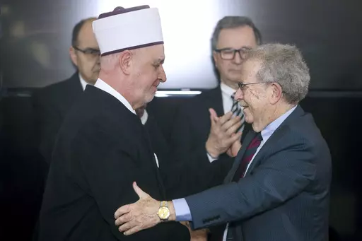 CAPTION CORRECTS ROLE OF ROSENSAFT General Counsel Emeritus of the World Jewish Congress Menachem Rosensaft, right, gestures with Bosnian Grand Mufti Husein Kavazovic, at the Srebrenica Memorial Center, on International Holocaust Remembrance Day, in Potocari, Bosnia, Saturday, Jan. 27, 2024. Jews and Muslims from Bosnia and abroad gathered in Srebrenica Saturday to jointly observe International Holocaust Remembrance Day and promote compassion and dialogue amid rising global sectarian hatred fuel