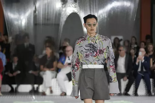 A model wears a creation as part of the Prada men's Spring Summer 2024 collection presented in Milan, Italy, Sunday, June 18, 2023. (AP Photo/Luca Bruno)