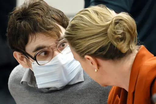 Marjory Stoneman Douglas High School shooter Nikolas Cruz reacts to the verdict in his trial at the Broward County Courthouse in Fort Lauderdale, Fla., on Thursday, Oct. 13, 2022. Cruz will be sentenced to life without parole for the 2018 massacre of 17 people at Parkland's Marjory Stoneman Douglas High School. That sentence comes after the jury announced Thursday that it could not unanimously agree that Cruz should be executed. (Amy Beth Bennett/South Florida Sun-Sentinel via AP, Pool)