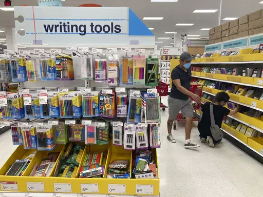 Shoppers look for school supplies deals at a Target store, July 27, 2022, in South Miami, Fla. An estimated $135 billion will be spent on back-to-school and back-to-college shopping in 2023, according to the National Retail Federation, representing the second-largest spending period of the year, behind only the holidays. But there are ways to help bring down some of those costs. (AP Photo/Marta Lavandier, file)