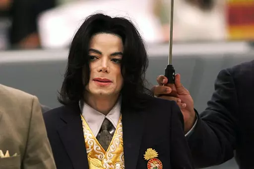 Michael Jackson arrives at the Santa Barbara County Courthouse for his child molestation trial in Santa Maria, Calif., on May 25, 2005. A California appeals court on Wednesday, July 26, 2023, will consider reviving the dismissed lawsuits of two men who allege Michael Jackson sexually abused them as children for years, a move the court appears likely to make after a tentative decision that would order the cases back to a lower court for trial. (Aaron Lambert/Santa Maria Times via AP, Pool)