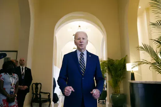 President Joe Biden smiles as he speaks about democratic control of the Senate before leaving his hotel to attend the Association of Southeast Asian Nations (ASEAN) summit, Sunday, Nov. 13, 2022, in Phnom Penh, Cambodia. (AP Photo/Alex Brandon)