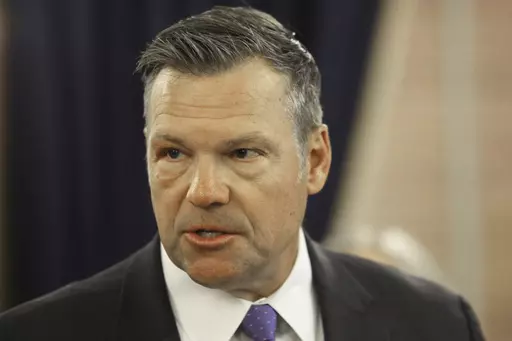 Kansas Attorney General Kris Kobach answers questions during a news conference about a new state law that defines male and female in state law so that transgender people can't change their driver's licenses and birth certificates to reflect their gender identities, Monday, June 26, 2023, at the Statehouse in Topeka, Kansas. The number of people making those changes jumped more than 300% this year ahead of the new law taking effect. (AP Photo/John Hanna)