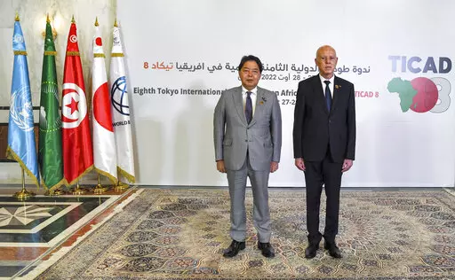 Tunisia's President Kais Saied, right, and Japan's Foreign Minister Yoshimasa Hayashi pose for a photo during the eighth Tokyo International Conference on African Development (TICAD) in Tunisia's capital Tunis on Saturday, Aug. 27, 2022. African heads of state, representatives of international organizations and private business leaders are in Tunisia this weekend for the eighth iteration of the Tokyo International Conference on African Development, a triennial event launched by Japan to promote 