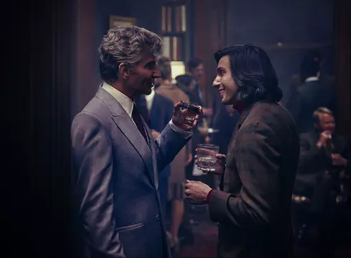 This image released by Netflix shows Bradley Cooper as Leonard Bernstein, left, and Gideon Glick as Tommy Cothran in a scene from "Maestro." (Jason McDonald/Netflix via AP)