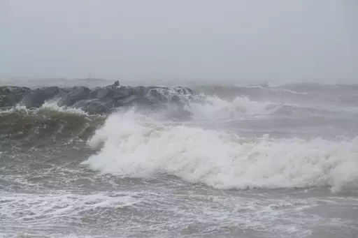 Waves crash at Outlook Beach in Hampton, Va., Sept. 30, 2022. Storms with strong gusting winds sometimes cause a phenomenon known as a meteotsunami, in which the winds push on the water and increase the wave height near the coast before it eventually crashes onto shore. (Billy Schuerman/The Virginian-Pilot via AP, File)