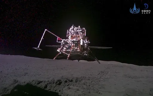 FILE -This China National Space Administration (CNSA) handout image released by Xinhua News Agency, shows the lander-ascender combination of Chang'e-6 probe taken by a mini rover after it landed on the moon surface, June 4, 2024. China's Chang'e 6 probe returned on Earth on Tuesday with rock and soil samples from the little-explored far side of the moon in a global first. The probe landed in northern China on Tuesday afternoon in the Inner Mongolian region. (CNSA/Xinhua via AP, File)