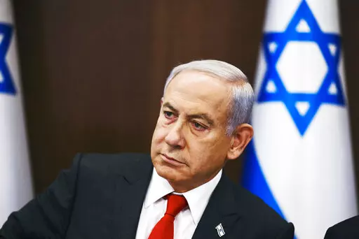 Israeli Prime Minister Benjamin Netanyahu convenes a weekly cabinet meeting at the Prime Minister's office in Jerusalem, Sunday, Jan. 8, 2023. (Ronen Zvulun/Pool Photo via AP)