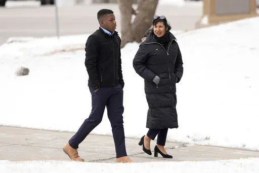 Ralph Yarl walks to the Clay County Courthouse to attend a hearing for Andrew Lester, who pleaded guilty in charges stemming from a 2023 incident when Lester shot Yarl in the head after Yarl mistakenly knocked on the Lester's door, Friday, Feb. 14, 2025, in Liberty, Mo. (AP Photo/Charlie Riedel)
