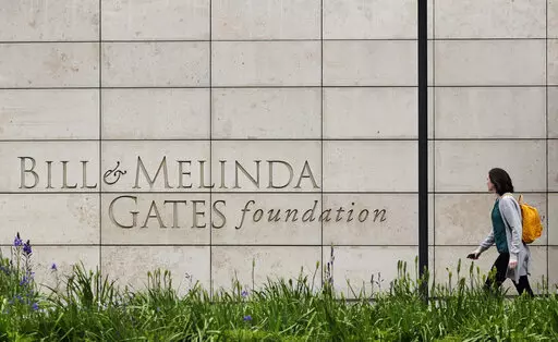 A person walks by the headquarters of the Bill and Melinda Gates Foundation on April 27, 2018, in Seattle. The Bill and Melinda Gates Foundation announced Sunday, Oct. 16, 2022, that it will commit $1.2 billion to the effort to end polio worldwide. (AP Photo/Ted S. Warren, File)