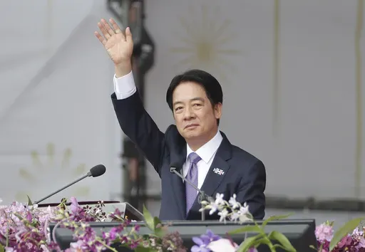 Taiwanese President Lai Ching-te waves during National Day celebrations in front of the Presidential Building in Taipei, Taiwan, Thursday, Oct. 10, 2024. (AP Photo/Chiang Ying-ying)