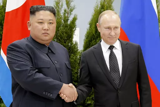 Russian President Vladimir Putin, right, and North Korea's leader Kim Jong Un shake hands during their meeting in Vladivostok, Russia on April 25, 2019. Kim may travel to Russia for a summit with Putin, a U.S. official said, in a trip would underscore deepening cooperation as the two leaders are locked in separate confrontations with the U.S. (AP Photo/Alexander Zemlianichenko, Pool, File)